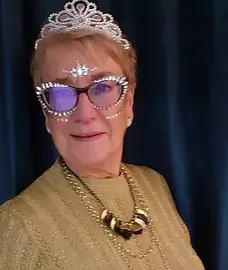 Jeanette Hackwell with friends wearing fun tiaras and sparkly glasses in support of Brain Tumour Support