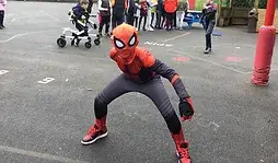 Young boy dressed as Spiderman as part of a charity fundraising Superhero event