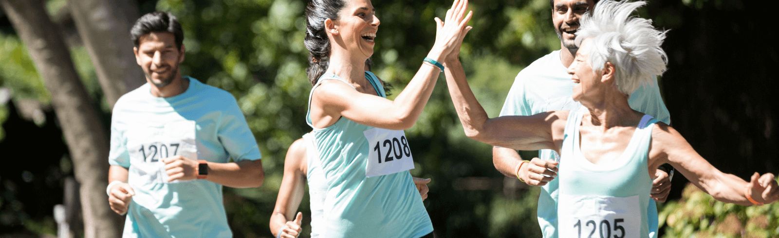 Group of people running together outdoors