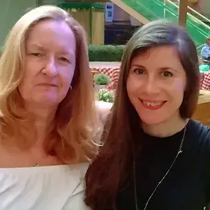 Friends, Karen and Lucy looking at the camera and smiling