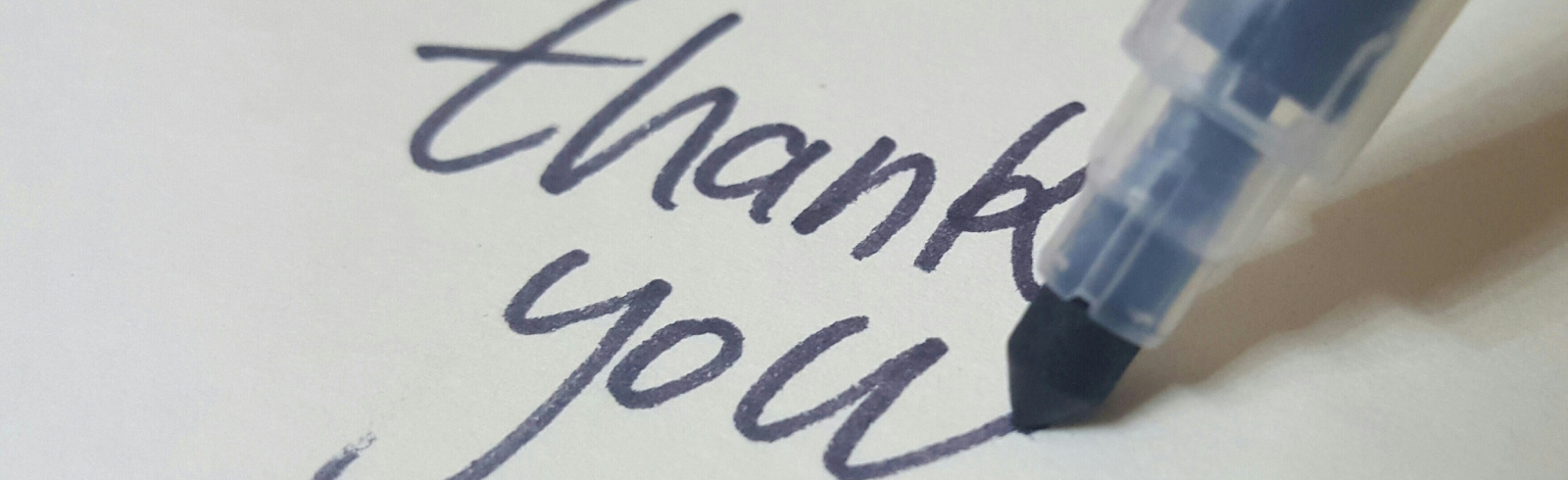 Thank you written with marker pen on white paper
