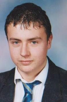 Late teenage boy in school uniform