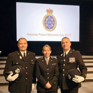 Three police officers in uniform for National Police Memorial Day