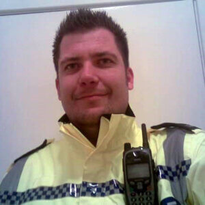 Young policemen in hi-vis jacket