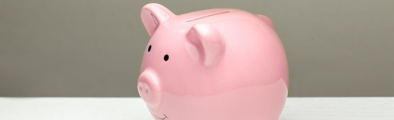 Donations of love and feelings, sympathy. Man puts heart in piggy bank