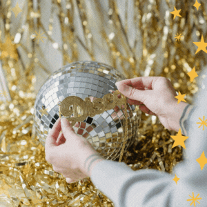 Fundraising events for Brain Tumour Support. Glitter ball and gold lametta strands for a disco party