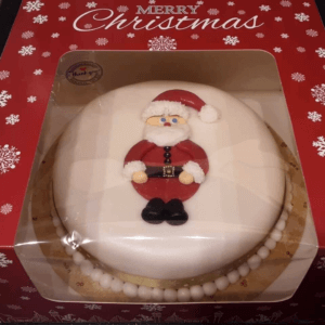 Hand made Christmas cake, in a box, decorated with icing Santa figure
