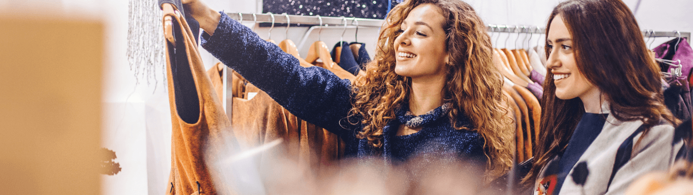 Two young women clothes shopping together
