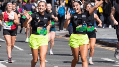 Runners in the Great Birmingham Run waving at the camera