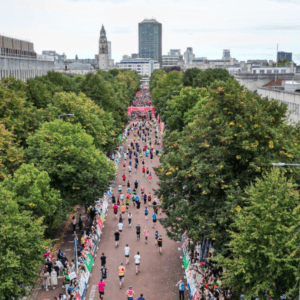 Cardiff Half Marathon runners against the city landscape