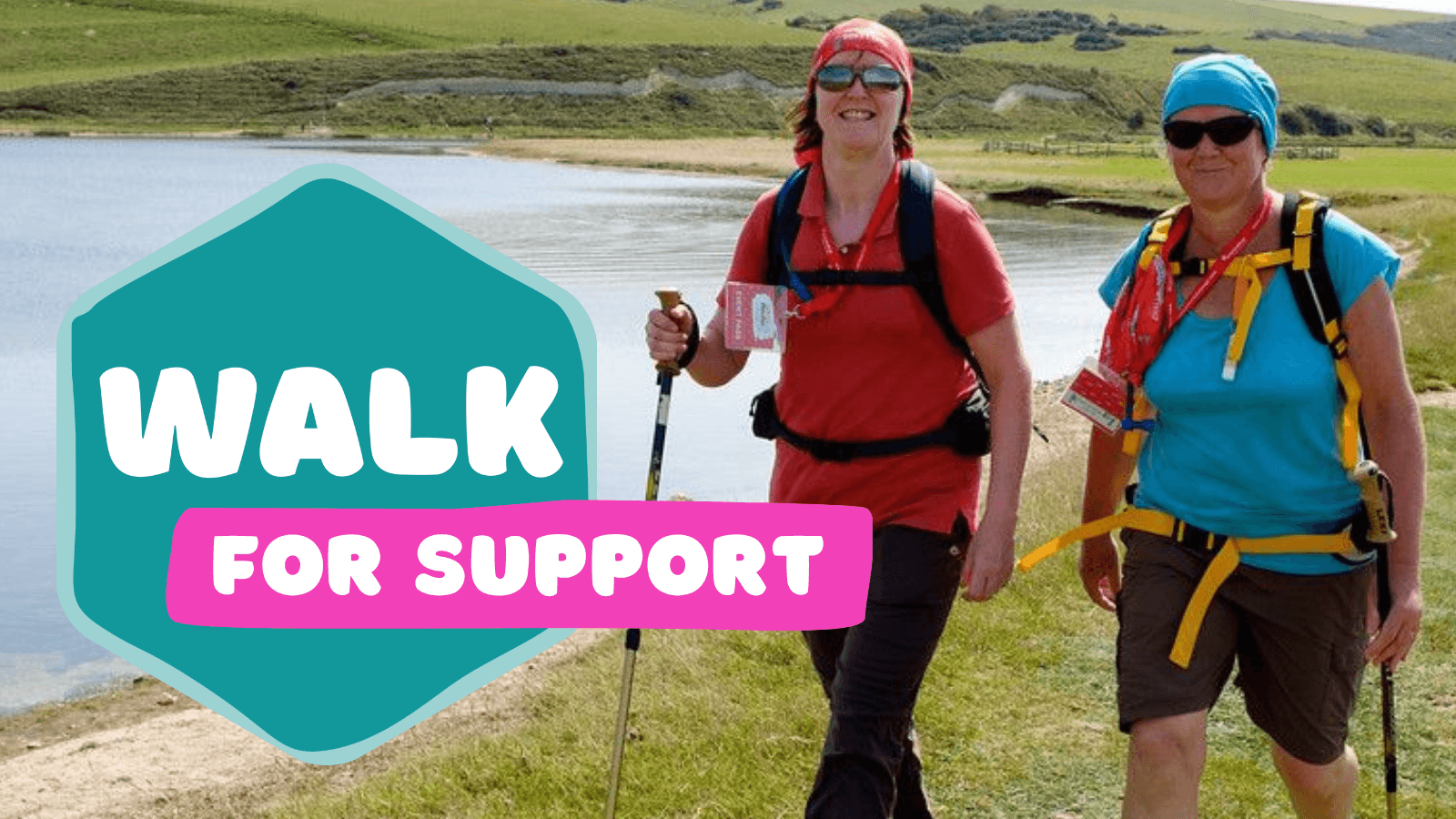 Two walkers with backpacks and walking poles taking part in Walk for Support along a scenic outdoor route.